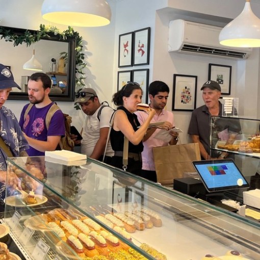 a group of people preparing food in a kitchen